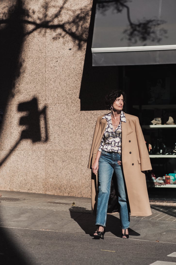 Mature Woman in Trench Coat in the City